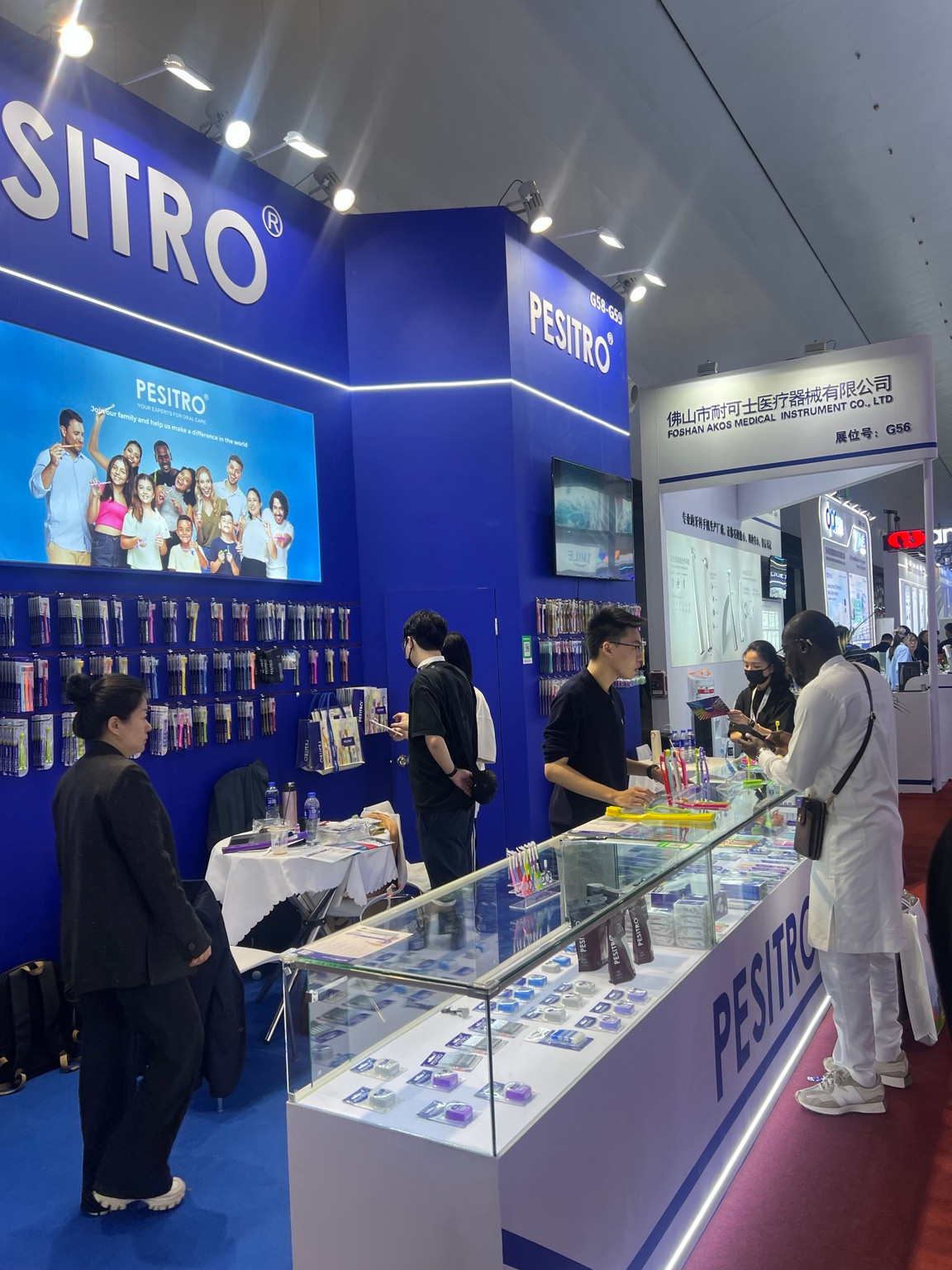 PESITRO booth and glass product-display cases at DenTech China 2026.