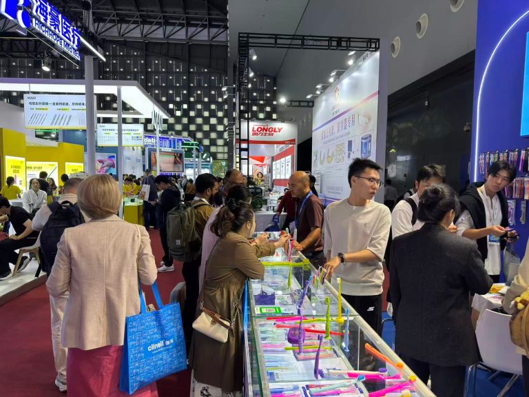 PESITRO product displays and visitors beside the exhibition aisle at DenTech China 2026.